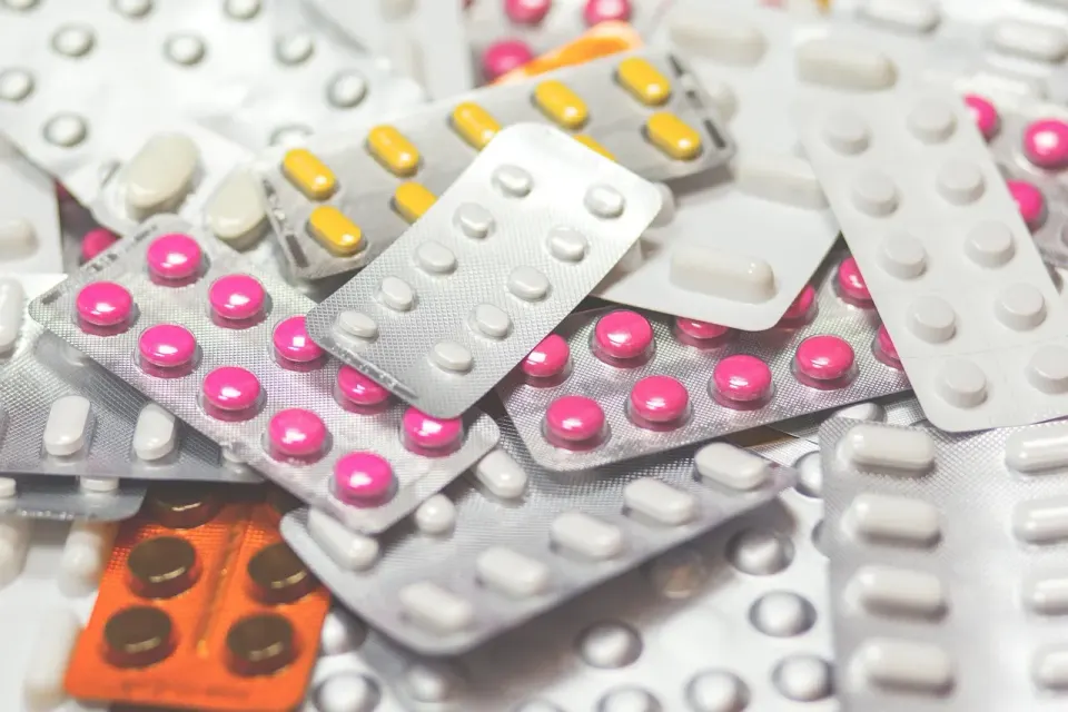 Prescription medications and tablets on a table