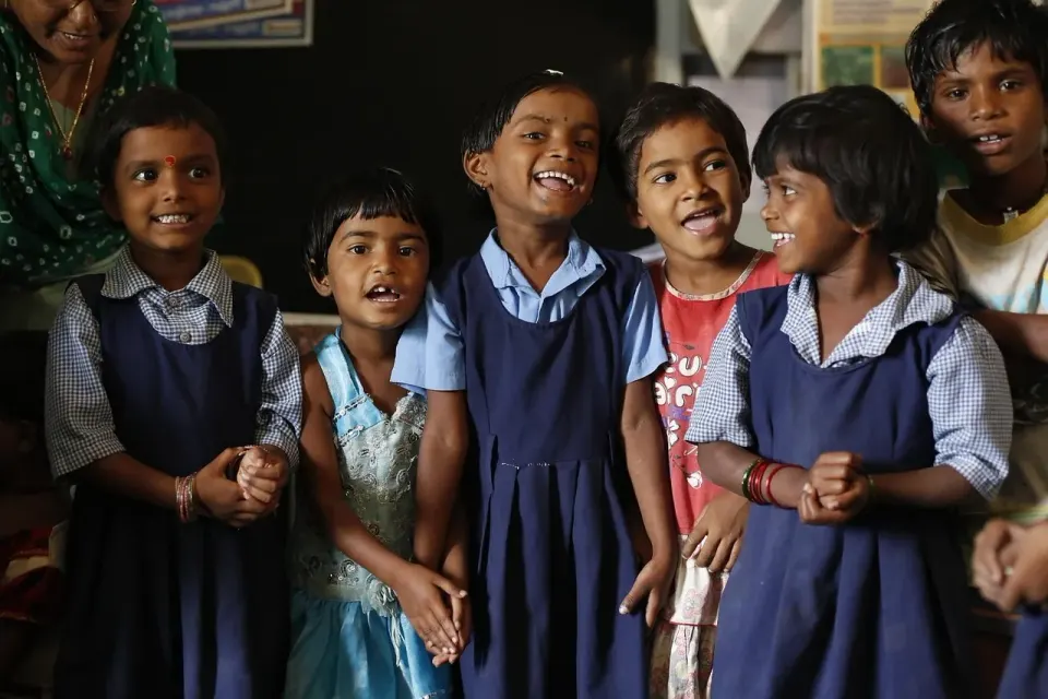Young children sitting together in a classroom
